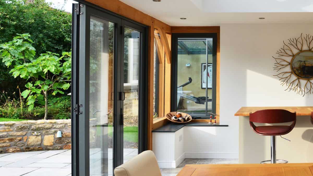 oak orangery with painted bi-fold doors