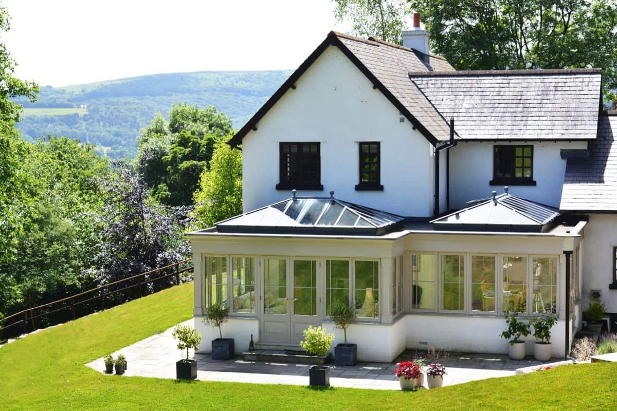 wooden orangery with lantern roofs