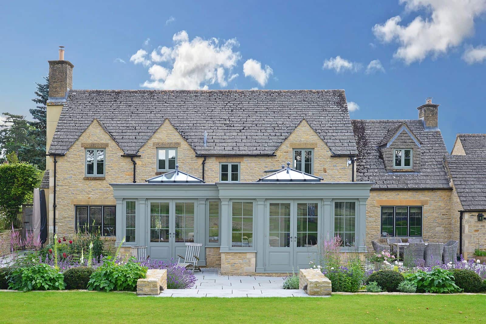 painted timber orangery in flagstone